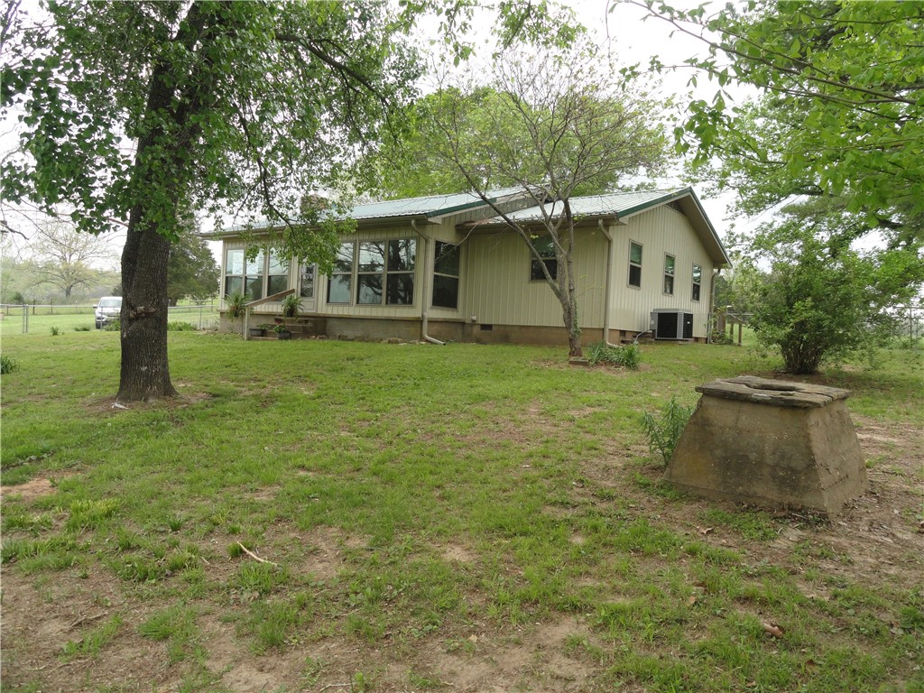 “Same as New” Country Gem on 40 Lush Acres – Fully Remodeled 2 Bed, 2 Bath Home + Shop, Carports, & Stocked Pond! Looking for peace, privacy & a move-in ready home that has it all? This beautiful 1,232 sq ft home was completely remodeled from the studs out in 2019 – literally everything is new: New roof, heat pump & ductwork, gorgeous granite countertops, appliances, large master suite, storm cellar, sunroom, 8x44 deck & fireplace insert for cozy wood heat sitting on 40 beautiful acres—perfect for livestock or hay production & includes a stocked pond with catfish/bluegill making it your own personal fishing hole right out back! Property features also include: Detached wooden carport, Portable metal carport, large workshop with sliding door (use as a garage or shop space), open-air equipment storage area. This is more than just a house, this is your dream country homestead. Everything’s been done for you, so you can just move in and start living the good life. Don’t miss this one – it’s the total package!