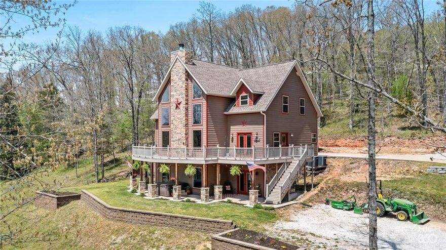 Rare Waterfront Estate!  Fishermans Paradise!!! Absolutely stunning custom home situated directly on the shoreline with 17+/- gorgeous acres.  Lake life doesn't get much better than this!  If you are looking for a new home, a lake getaway or a vacation rental property, this one checks all the boxes. At 4200 sf, featuring 4 bedrooms, 3.5 bathrooms, gorgeous chef's kitchen, tons of living and entertaining space, hot tub, over 1200sf of deck to overlook the water, an owner's suite like no other with walk in closets, beautiful bathroom, soaring ceilings and more! But you didn't come for the house! Step outside and enjoy firepits on the 300 feet of shoreline, a pergola for those perfect afternoon picnics and so much more!!!!! This rare property is a true gem! Public Water.