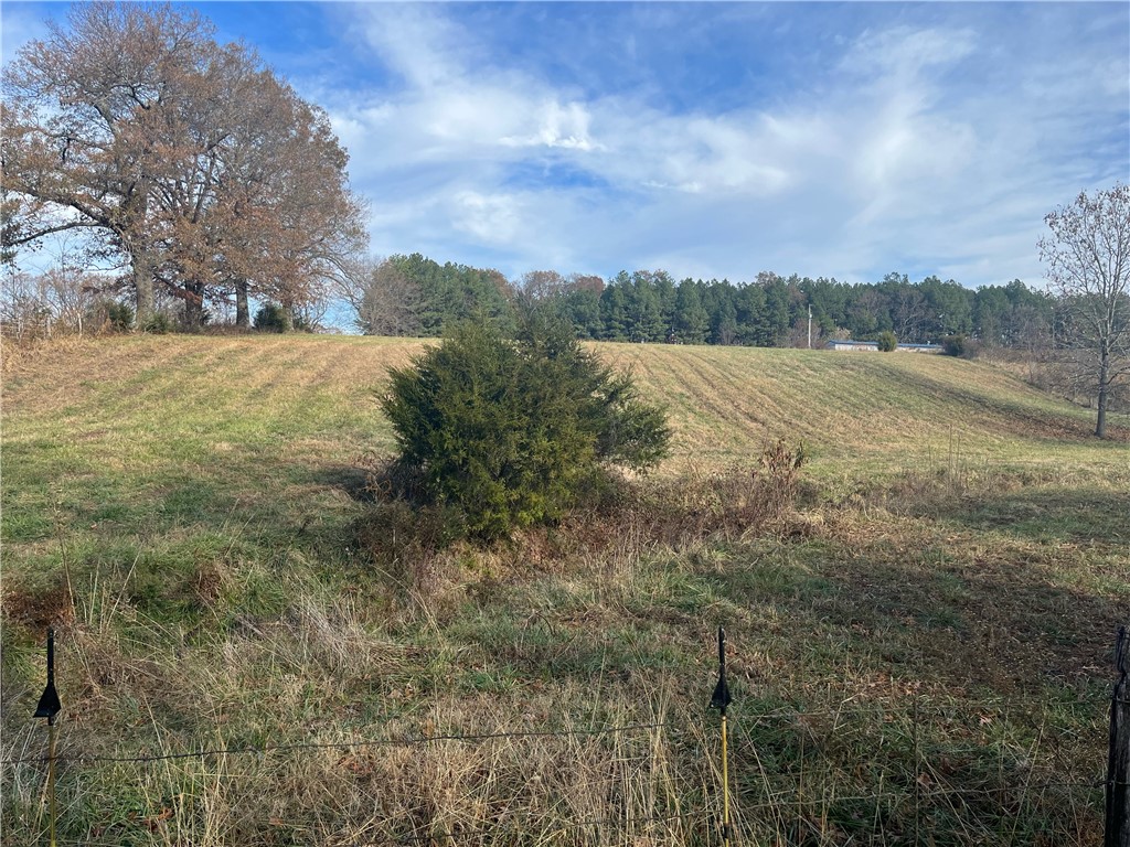 Beautiful cleared 3.48 acres with rolling hills and number of building locations on the property. Approx. 17-20 minutes from Springdale and minutes from Huntsville, right off Hwy 412 on quiet dead end road. This property has a wet weather stream that runs across the front that sits well on the property