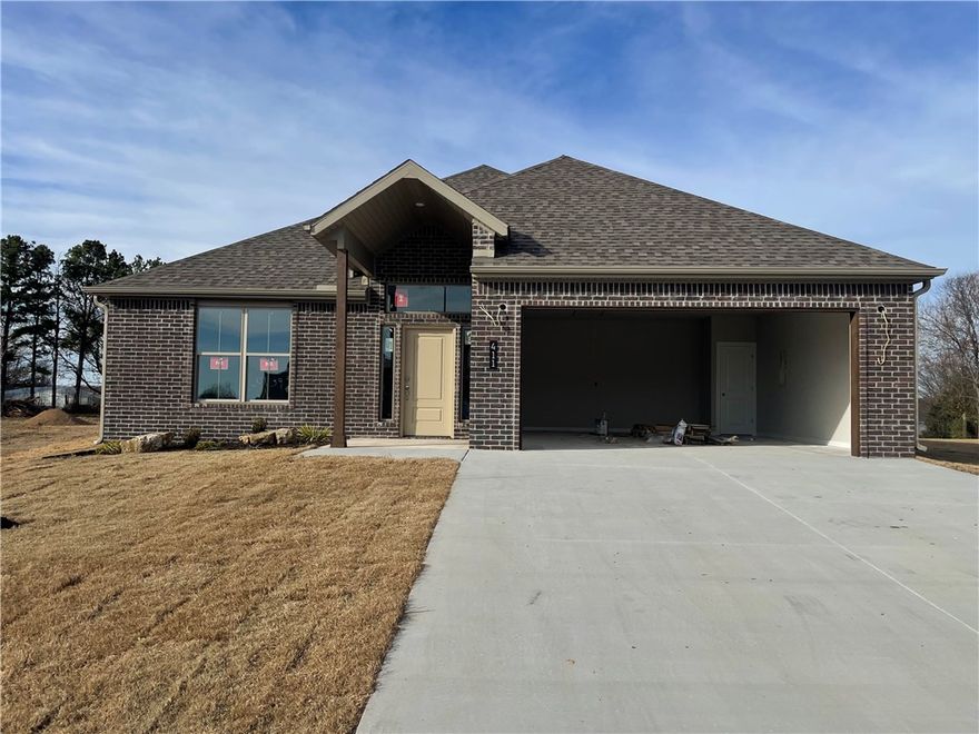 Beautiful one level new construction in Heritage Ranch Subdivision. Located on a large exterior corner lot, enjoy an amazing, upgraded yard space! This home boasts high end features throughout including Luxury Vinyl Plank flooring, Designer Finish Selections, and Quartz Counters to name a few. The bright entry welcomes you in with access to three large guest bedrooms and a guest bathroom. The living space is spacious and open, great for everyday and for entertaining guests. The large eat-in kitchen has plenty of natural light, counter bar seating, and a huge pantry space. The living room boasts large windows overlooking your private backyard, along with a gorgeous fireplace with built in shelving feature. Ample dining space offers more living layout options. The primary suite is a private retreat with luxurious attached bath including a soaking tub, double vanity, large shower, and WIC that connects to laundry. Located close to Schools and Parks with easy access to Downtown Siloam