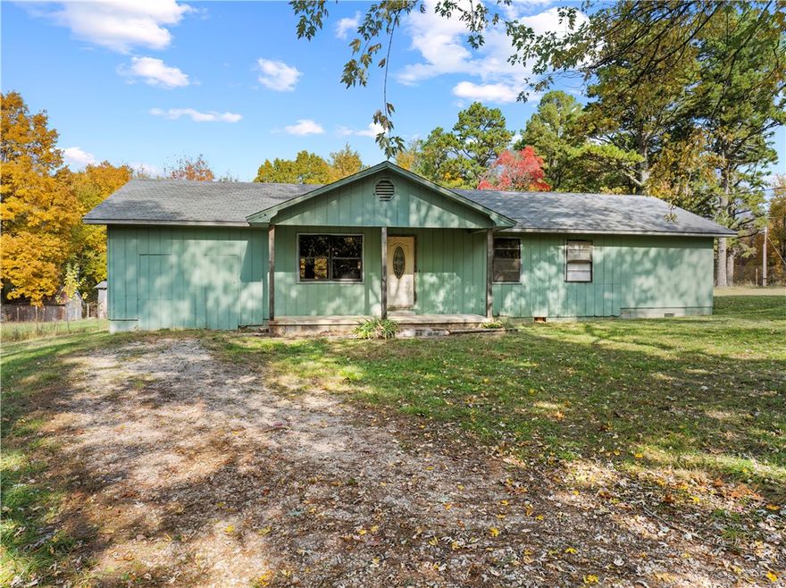 Discover the quiet charm of the Ozarks in this inviting 3-bedroom, 1.5-bath home on 2.72 mostly level acres in Wayton, Arkansas. With 1,647 square feet of living space, an open layout, and beautiful rural surroundings, this property offers comfort, functionality, and plenty of room to enjoy life in the country. Inside, an open-concept with eat-in-kitchen, living and dining area makes entertaining easy and comfortable. The primary bedroom includes a huge walk-in closet, offering exceptional storage and convenience. Enjoy the peaceful setting from your fenced back yard, where deer and other local wildlife are frequent visitors or go just off the property to access the vast Ozark National Forest. The 2.72-acre lot is mostly level, giving you space for gardening, pets, or outdoor projects. An oversized pole shed and separate shop with electric provide excellent storage for equipment, vehicles and a place for your hobbies.  Call to take a look today!