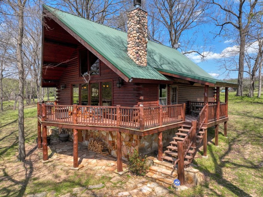 Float to and from your own Kings River log cabin! This gorgeous home includes dedicated access to the Kings River and a huge gravel bar! This beautiful three-bedroom, three bath retreat would be an excellent full-time residence as well as having room for friends and family. Enjoy the view from the front deck or through the large windows, while spending time in this wonderfully open floorplan. Large logs and beams make for a truly impressive sight when you enter, and the functionality and coziness of this home will make you love it! Paved roads lead all the way to the property and its location gives you equally easy access to Eureka Springs and Berryville!