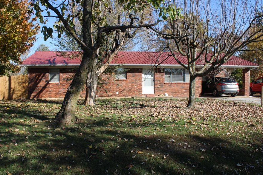 Check Out this Brick 3 bedroom 2 bath Home with Sunroom plus covered patio & privacy fenced yard!! Features spacious living area that stretches the full width of home with entry to sunroom for extra living space, large kitchen/dining combo, split bedroom plan, partial basement for extra storage and severe weather concerns, single carport with easy entry to home. Includes paved road location just outside the south end of Harrison in Valley Springs school district on 0.68 acres, new privacy fence enclosing back and side yard new interior paint and flooring. Come see this one today!!