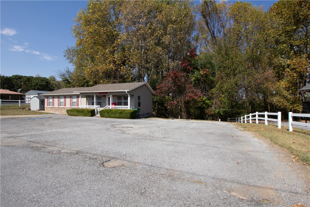 Great opportunity for your new place of business! This building is in an ideal location with major road frontage right off of Hwy 12 East, with large traffic flow. Beaver Lake public boat ramp & beach is only 2.4 miles away, while Prairie Creek Marina & Campground is only 1.1 miles away. This building has been well maintained during its office space days. It has 5 main offices, a lobby, a conference room, 2 restrooms and a nice back deck that overlooks the woods. This building has many potential uses and is move in ready.