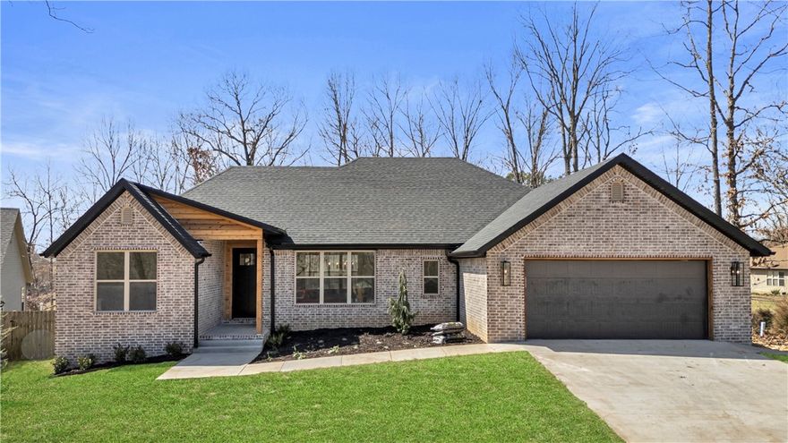 Beautiful Bella Vista New Construction sitting on a wooded flat lot in a quiet cul-de-sac. 3 bedroom + flex room/2 bath home featuring a popular plan that includes an open concept with split bedrooms. Boasting lots of natural light, high-end quality finishes: solid surface flooring throughout entire home, living room fireplace w/hearth, quartz countertops, pantry & custom soft close cabinets. Spacious primary suite has a spa like bath with double vanities, custom tile shower. Primary closet connects to laundry room. Enjoy time on the covered patio featuring a flat, fully sodded backyard & custom landscape package. Located very close to Scottsdale Golf Course & Pub + just a short drive to Highlands retail area. Green space POA land lies behind the lot so you'll have no neighbors in backyard. $0 down payment, 100% financing, rural development loan available. Blinds and gutters included in purchase price.
