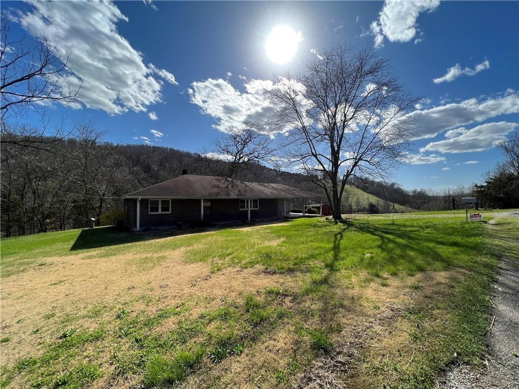 Perfect starter home! This home holds a nice view off the back deck, spacious covered parking, and large living room. Close enough to town to make a quick trip yet far enough off the path to have a little more privacy. Having paved county road frontages makes it an easy drive to Green Forest or Berryville as well as quick assess to 412.