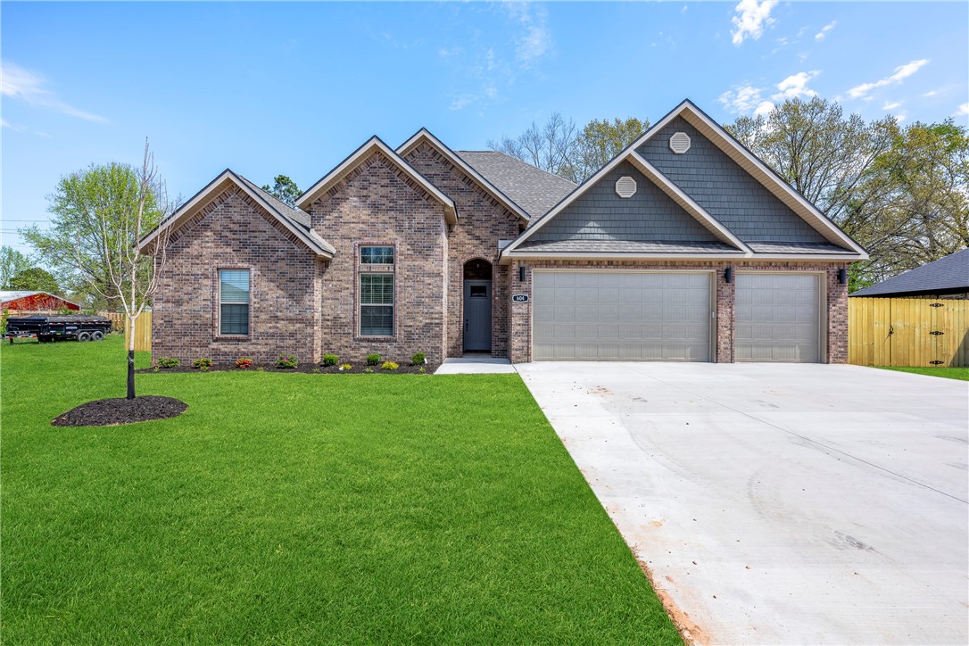 Impeccably designed & crafted, this all-brick home exudes sophistication & modern charm. Tucked away in a well-established neighborhood, it delivers such a true sense of belonging. Enter into a spacious, sun-drenched open living space adorned with a beautiful wood flooring. Enjoy the seamless blend of quality & style with custom cabinetry & granite countertops throughout, elevating both functionality and aesthetic appeal. The eat-in kitchen, complemented by a central island, offers a perfect setting for both family bonding & entertaining friends. This desirable single-level home offers abundant space, featuring four bedrooms, three full baths - including a spacious Jack & Jill bath, a covered outdoor living area in the rear, a three-car fully insulated garage, & ample attic storage. Don't overlook the added benefits of this new construction, boasting extra insulation, radiant roof decking, blinds, gutters, fence, & a fully sodded yard - this complete package is designed for comfort, value & years of enjoyment!