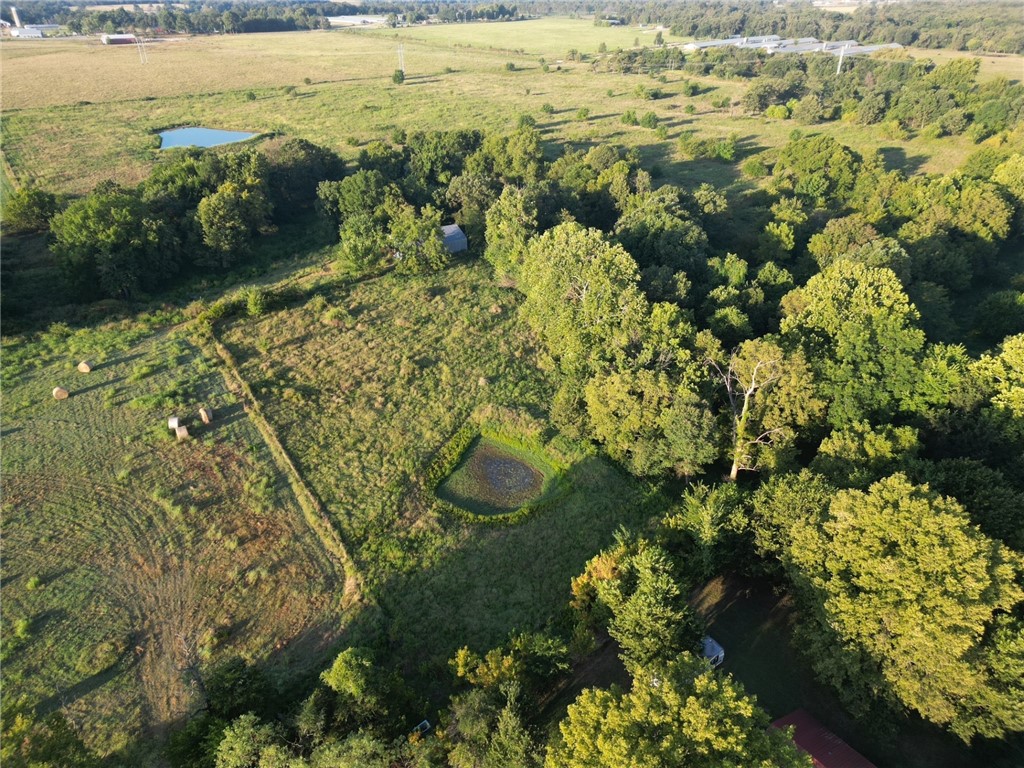 20 Acres of Opportunity – Prime Land with Endless Potential! This beautiful property offers the perfect balance of seclusion and convenience with paved frontage, just minutes from town. A mix of wooded areas and open pasture, plus two serene ponds, create a versatile landscape ideal for a custom home, hobby farm, or weekend retreat. Multiple building sites give you flexibility to bring your vision to life, while a hay barn adds functionality from day one. Rural water and electric at the road make it easy to start your project. With its peaceful setting and wide-open potential, this is the perfect canvas for your peaceful country living with room to grow.