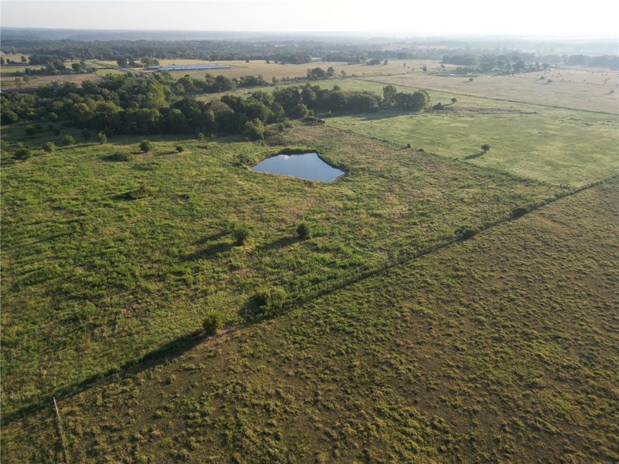 20 Acres of Opportunity – Prime Land with Endless Potential! This beautiful property offers the perfect balance of seclusion and convenience with paved frontage, just minutes from town. A mix of wooded areas and open pasture, plus two serene ponds, create a versatile landscape ideal for a custom home, hobby farm, or weekend retreat. Multiple building sites give you flexibility to bring your vision to life, while a hay barn adds functionality from day one. Rural water and electric at the road make it easy to start your project. With its peaceful setting and wide-open potential, this is the perfect canvas for your peaceful country living with room to grow.