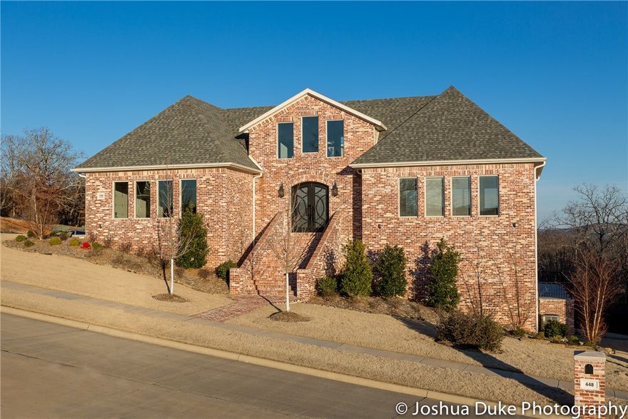 Absolutely the most stunning custom home with every feature to entertain on 3 levels. Gorgeous custom tile work, 10' ceilings, 8' doors on every level. If you want the new modern look and feel for entertaining, this is it! 360 degree views of the Boston Mountains and Mt. Sequoyah. 65 Pella Windows to show you the views. This custom home was built with the highest quality of poured wall concrete foundation. Superior energy rating. 30x20 gunite pool with large enough pool deck to entertain 200 people. If you want views, privacy, custom modern feel and look with a great pool to entertain guests, look no further!