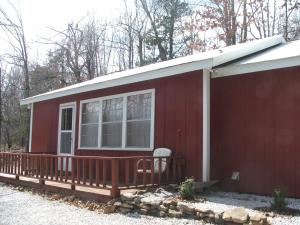 Need a home or a weekend get-a-way? Check out this neat cabin with a Great Room, bath & large utility. Located between the Buffalo River and Harrison. Secluded, yet convenient to town! Wooded acreage and rural water. Cute! You really need to take a look at this one!