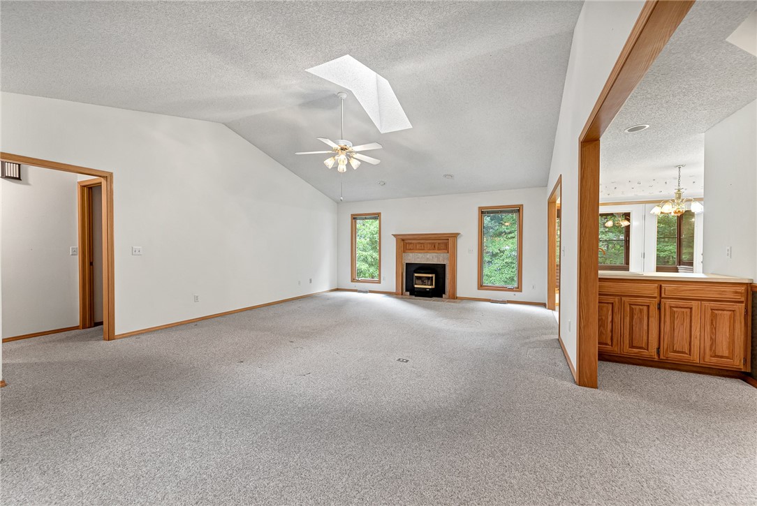 Discover this charming home in the Highlands of Bella Vista, tucked on a quiet, tree-lined street. The backyard features established garden beds, a 10x12 storage building for lawn tools, and a downstairs workshop for your projects. Inside, the open, light-filled layout offers a spacious eat-in kitchen and living room with a cozy pellet fireplace, plus a formal dining area and convenient wet bar. Relax or entertain on the screened-in porch and deck, surrounded by nature. Home is on the sewer connect list. Enjoy the best of Bella Vista living in this inviting retreat!