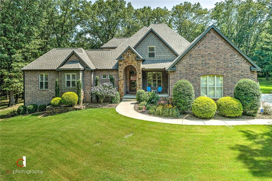 Location, Location, Location! Gorgeous custom build on 2.75 acres in Ozark Acres subdivision!! Enjoy being close to Downtown shopping/dining/entertaining, I-49, some of the best schools in Bentonville all while secluded on your own 2.75 Acres! THIS HOME WAS MADE FOR ENTERTAINING! Huge backyard oasis with private pool, covered patio, outdoor fireplace and more! New Roof in 2020. New Lighting, and Paint in 2021.