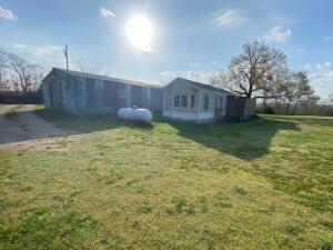 Lots going for this 1 bedroom mobile with a 24x97 shop bldg with concrete floor. Only 4 miles to Harrison and 30 minutes to Branson. All this on just under one level acre for future build.
