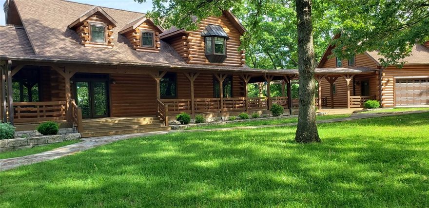 47+acre peninsula tip 3800 ft shoreline..Private lake retreat, own your own peninsula on Beaver Lake. Immaculately maintained log home w/ private boat docks, 2 swim dock 3 car garage w/shop has a 2 bedroom apartment above. The natural landscape is enhanced with Limestone terracing to create outdoor spaces. Upper level of the home is perfect for guests and family. On your way down to the docks is a screen cabin with water and electric, and plenty of flat land for entertaining. Move in ready with amenities
