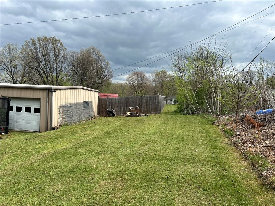 Solid brick home with superior craftsmanship.  Large lot, fenced yard, and 24' x 28' shop building with two garage doors and shelving plus bonus overhead storage.  Large rooms throughout.  Formal living room plus a kitchen, dining, family room combination.  2 car attached garage has room for storage.  A large home waiting for you to make it your own.  Fall in love with the built in shelving, original light fixtures, bright living areas, and large yard.  Conveniently located, just off hwy 65 south.  Minutes to Harrison.  Recent survey with lot markers still in place.