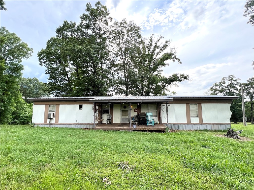 This 2 bedroom 2 bathroom manufactured home on 6.65 acres is exactly what youāve been looking for. Quietly tucked away from the road only 1 mile off of pavement, with utilities in place and a beautiful view from the back deck. Perfectly situated between Huntsville and Eureka Springs, this is the spot to be. The mobile home is surrounded by mature trees and wildlife. Take advantage of the additional utilities available from previous mobile home for an RV hookup or bring another mobile home on site. With a place to relax and plenty of room to roam, your options are endless! Sold as-is, no repairs or disclosures.