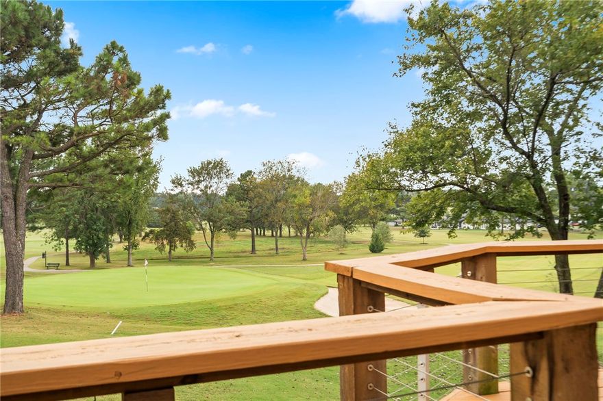 A golfer's dream on the 6th green! Enjoy expansive views of the Springdale Country Club golf course from the two decks of this completely remodeled home. This beautiful home was redesigned for entertaining with an open floor plan, vaulted ceiling, floor-to-ceiling rock fireplace, and gourmet kitchen. An all-weather sunroom adjacent to the kitchen, a spacious primary bedroom and ensuite bath with huge tiled shower and dual-sink vanity, and a second bedroom and bath complete the main level. A lower level apartment with 1 BR/1 BA, living room, kitchenette, and storage, separate ground-floor access, and patio has endless possibilities (in-law quarters, rental, home office, man cave, etc.). Plus, a 300 sf workshop! Completely rewired/replumbed, new flooring, new windows and doors, and a new roof (2025), you'll have nothing to worry about except how soon you can start your next chapter! In addition, the home is perfectly located near shopping and restaurants, Lake Fayetteville, and 10-15 minutes to Tyson HQ and I49.