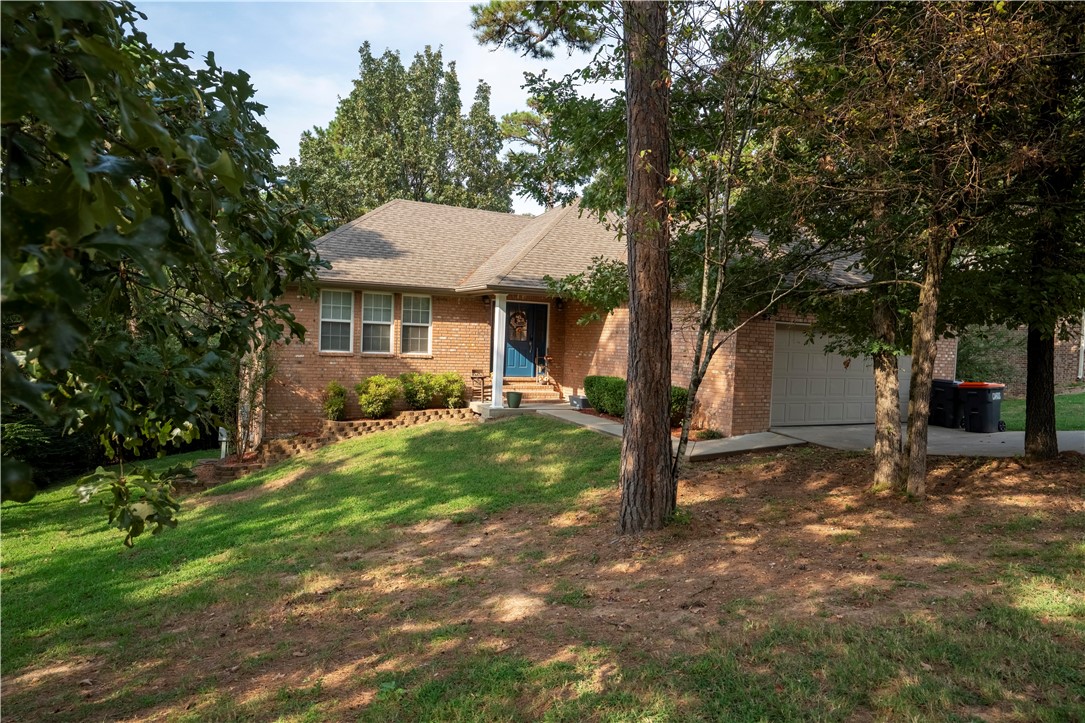 Pretty and pleasing perfectly describe this splendid 4-bedroom, 2.5-bath home tucked away in beautiful West Russellville! The charm begins at the curb with welcoming appeal, then continues inside where you'll find stylish laminate flooring, freshly painted cabinets, and a spacious master suite featuring a separate tub and shower plus generous walk-in closets. A cozy new fireplace anchors the living room, while not one but two freshly updated decks invite you to relax or entertain outdoors. With thoughtful updates throughout, wood burning fireplace, this home is ready for its next happy chapter!