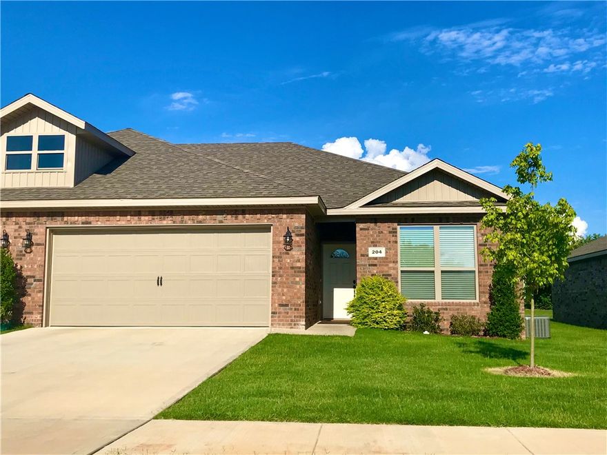 Spacious 3 bed 2 bath home in central Pea Ridge just minutes from Bentonville and Rogers. This open floor plan features hardwood tile throughout the common areas and in the kitchen enjoy granite counters and stainless steel appliances including the fridge. This home also features large carpeted bedrooms and in the master bathroom you will find plenty of storage and counter top space with dual sinks and a large walk in shower. Also included with this home is a Washer and Dryer! Outback lounge or BBQ on the spacious covered patio that opens up to a level spacious yard. Lawn care and landscaping is included. Yards are not fenced other than a divider fence between units. Pets are allowed with an additional $250 per pet refundable deposit. An additional monthly pet rent applies.