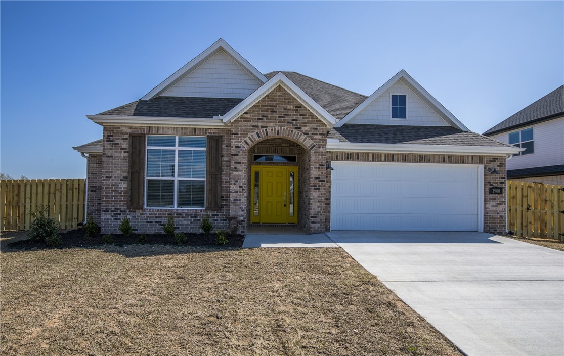 Welcome to Chandler Run, this new construction home features 3 beds, 2 baths. Home features granite counter tops, stainless appliances including gas range. Hardwood flooring in Living Room, Entry, Ceramic tile in Kitchen/dining with carpet in bedrooms. Includes walk-in closets through out home. A gas log fire place in living room. Primary bedroom has separate tub and tile shower. Fenced yard. Close to Rogers High School.