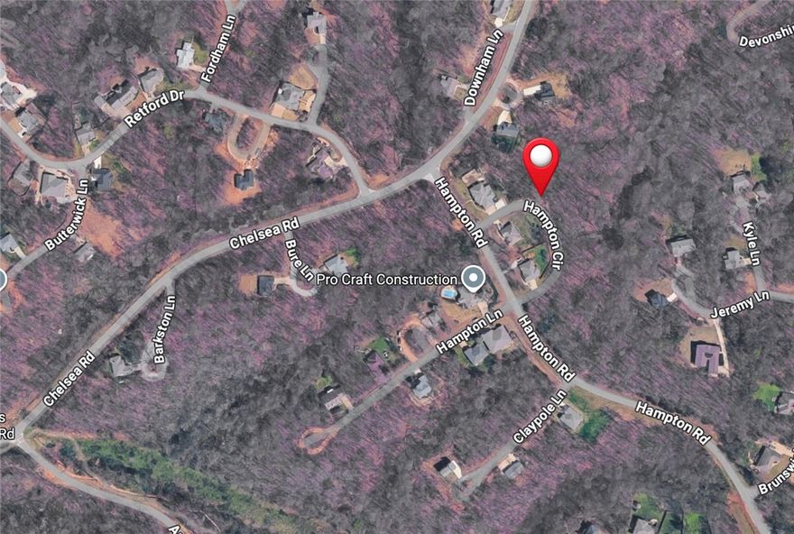 Discover the perfect canvas for your dream home on this spacious 0.36-acre lot in the desirable Hampton Subdivision of Bella Vista. Nestled in the highly sought-after Bentonville School District, this buildable lot offers an exceptional opportunity to create your custom retreat in one of Northwest Arkansas's premier communities. The gently sloping, wooded terrain provides natural privacy while maintaining easy access to everything that makes Bella Vista special. Located near Lake Windsor and surrounded by an abundance of outdoor recreation, you'll enjoy proximity to scenic biking and walking trails, area golf courses, and the full spectrum of Bella Vista POA amenities. With public water at the street, paved road access, and a location that balances tranquility with convenience, this property is ready for your vision.