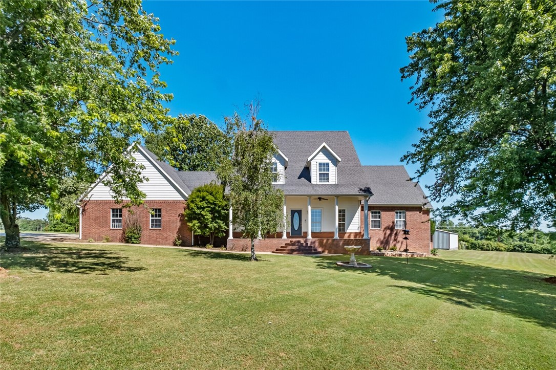 Blending of country living, picturesque views & city conveniences make this exceptional 5 Acre property a rare find. Private drive emphasizes gorgeous setting for this home w/pool, workshop, pole barn, raised garden beds, fruit trees, chicken coop & more. Classic front porch invites you into comfortable living & sitting area w/FP, Sunroom, abundant natural light, eat-in kitchen & dining w/updated appliances, granite counters & pantry. Unbelievable laundry/craft/flex room plus guest/pool bath w/direct access to outdoor entertaining. Primary suite w/ oversized bath & huge walk-in closet. Upper-level w/game/bonus area separating two guest suites each w/own en-suite bathroom & walk-in closets. Pool w/newer gunite & cool decking offer perfect backdrop for entertaining on covered deck w/ built-in bar area. 32'8 x 28 garage, detached 600 SF Garage/workshop w/electric & water, 1500 SF Pole Barn. Attic space for future expansion. New Hot water tank, Main level HVAC 2022. This property will not disappoint.