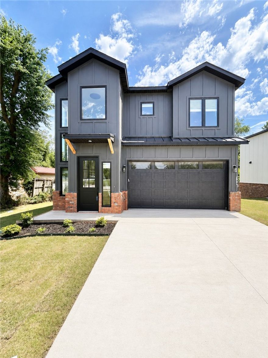 New construction home near downtown Bentonville! Located near bike trails, schools, the Neighborhood Market, Airship Coffee, and provides easy access to I-49! This modern home features 5 bedrooms and 4.5 baths! The primary suite boasts a huge walk-in closet, custom tile shower, and soaking tub. Enjoy a gorgeous entry staircase and the abundance of natural light throughout! Wood floors! (no carpet) Entertain in the kitchen, complete with floor-to-ceiling custom cabinets, a large island, 3 cm quartzite countertops, gas range, and pantry. 2 car garage. Custom finishes throughout. As an added bonus, receive $3,500 towards buyer's closing costs when working with the builder’s preferred local lender! Schedule your showing today!
