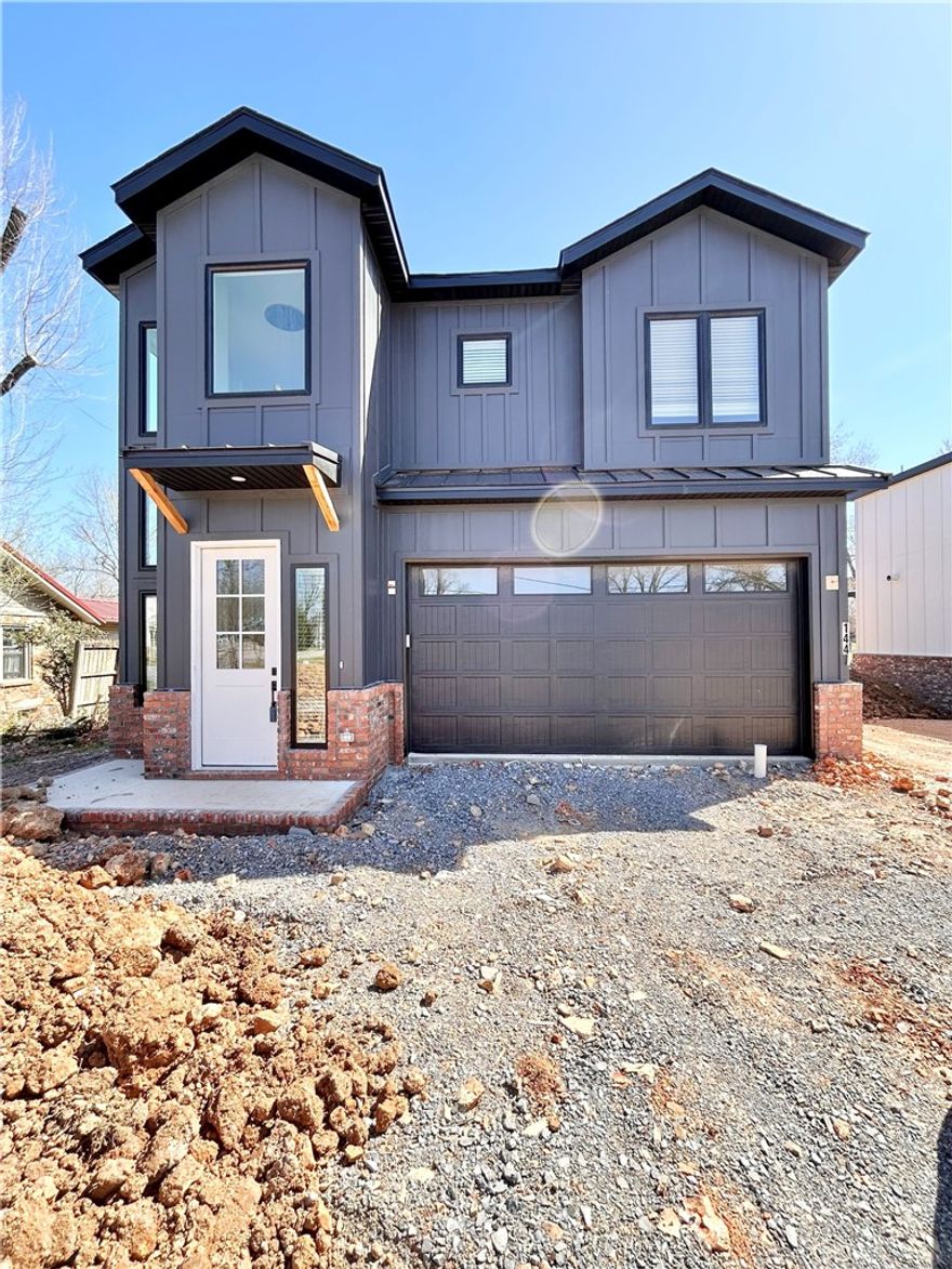 New construction home near downtown Bentonville! Located near bike trails, schools, the Neighborhood Market, Airship Coffee, and provides easy access to I-49! This modern home features 5 bedrooms and 4.5 baths! The primary suite boasts a huge walk-in closet, custom tile shower, and soaking tub. Enjoy a gorgeous entry staircase and the abundance of natural light throughout! Wood floors! (no carpet) Entertain in the kitchen, complete with floor-to-ceiling custom cabinets, a large island, 3 cm quartzite countertops, gas range, and pantry. 2 car garage. Custom finishes throughout. As an added bonus, receive $3,500 towards buyer's closing costs when working with the builder’s preferred local lender! Schedule your showing today!