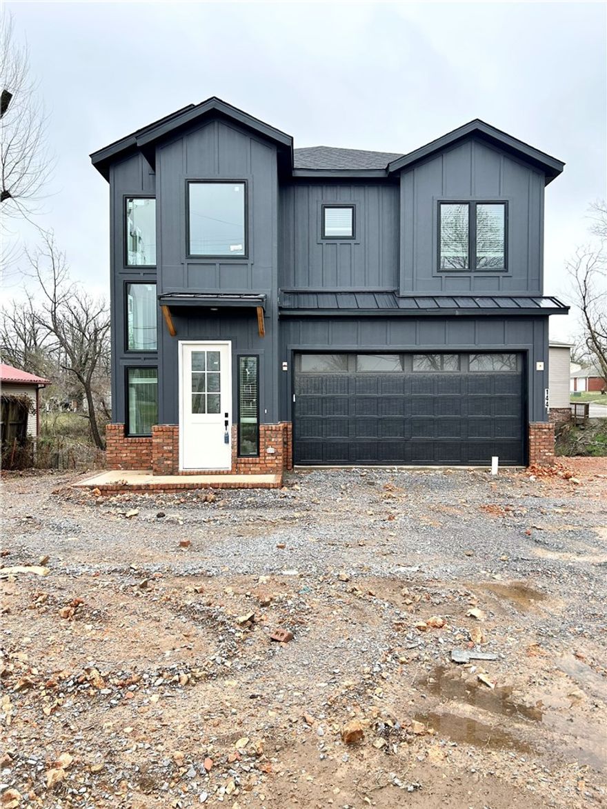 New construction home near downtown Bentonville! Located near bike trails, schools, the Neighborhood Market, Airship Coffee, and provides easy access to I-49! This modern home features 5 bedrooms and 4.5 baths! The primary suite boasts a huge walk-in closet, custom tile shower, and soaking tub. Enjoy a gorgeous entry staircase and the abundance of natural light throughout! Wood floors! (no carpet) Entertain in the kitchen, complete with floor-to-ceiling custom cabinets, a large island, 3 cm quartzite countertops, gas range, and pantry. 2 car garage. Custom finishes throughout. As an added bonus, receive $3,500 towards buyer's closing costs when working with the builder’s preferred local lender! Schedule your showing today!