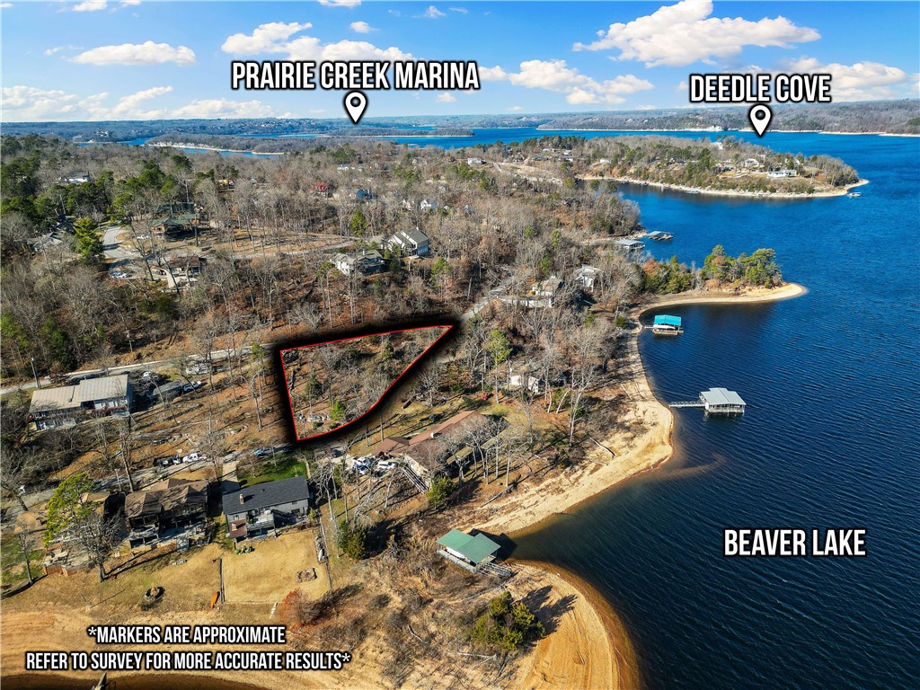 Prime Beaver Lake lot with .35 acres with a fantastic view of the main channel of the lake. Recently perc'd for a 3 bedroom home, with Rogers City water - build your dream lake home. Home does not have a boat dock but has an easement directly to the water and multiple coves in the neighborhood for water sports. The neighborhood also has a paved trail to walk or ride. Enjoy your lake life while being 9 miles from downtown Rogers. See listing 1295990 also for listing which includes this lot and a home on 64 Riviera Drive.