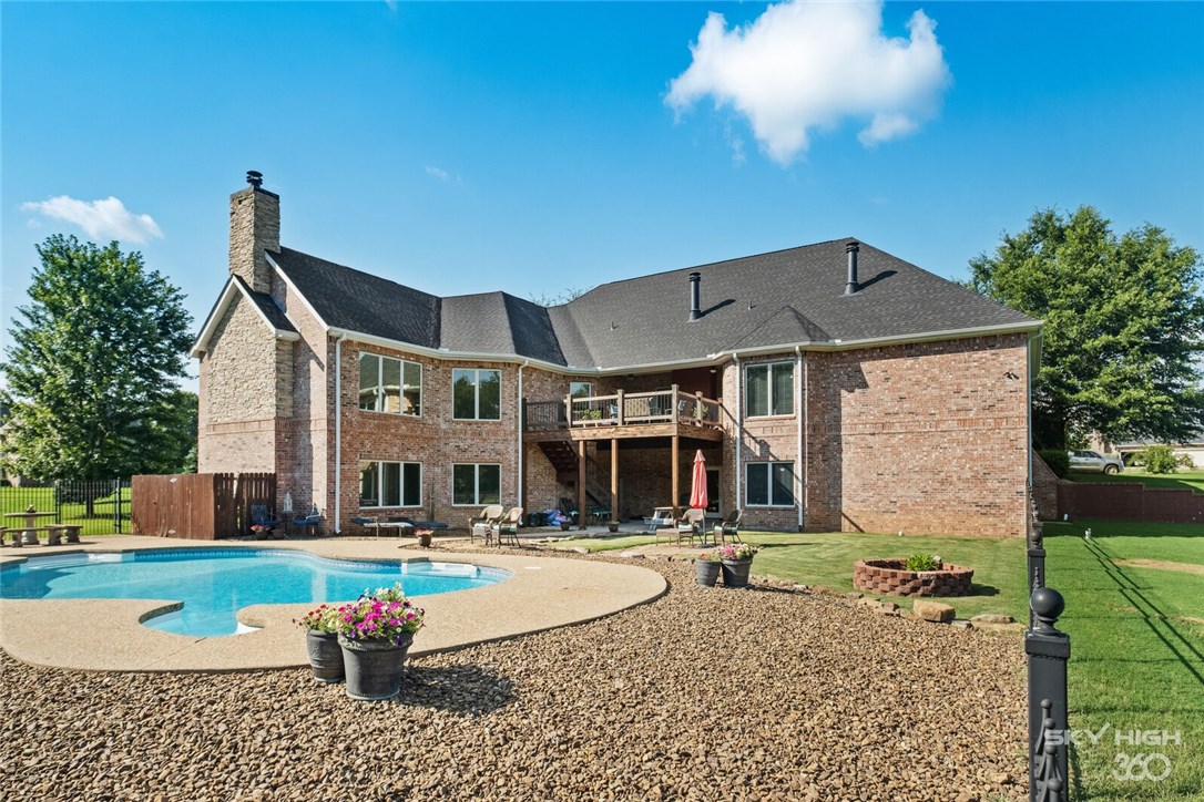 If you are looking for space to spread out, this home is a must see!. It's a sprawling 7,558 sq ft and sits on 2.14 manicured acres, in one of Fayetteville's premier gated communities. This gorgeous home features a beautiful in-ground pool with outdoor living space, 7 bedrooms, 7 baths, multiple living spaces, eat in kitchen, formal dining room, library/study, and an over sized 4 car garage! The finished walkout basement has a large self contained 2 bedroom apartment with it's own full kitchen, dining area and living room; perfect for college students or your mother-in-law! There is also a HUGE Media/Game room in the finished walkout basement and a large landing area with built-in storage, that opens up to the Pool area. New roof in 2019. This home is priced to sell so schedule a showing today!