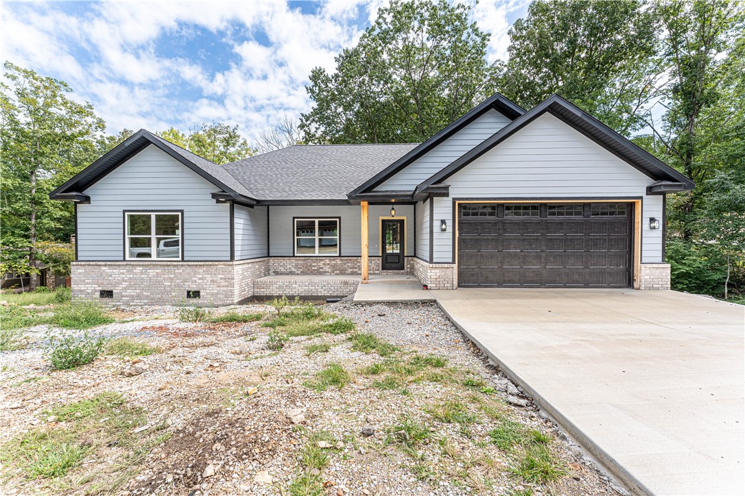 Welcome to your dream home in Bella Vista! This 3-bedroom , 2-bathroom home with an office is the perfect place to relax and unwind. The spacious living room features vaulted ceilings, custom cabinets, and a captivating wood beam. Hardie board siding and luxury vinyl flooring throughout the home add durability and elegance. The large, covered deck is the perfect place to relax and enjoy the views. The kitchen features Samsung smart home Bespoke appliances. The home is also located just minutes from the Razorback Greenway and the Slaughter Pen Mountain Bike Trails, making it the perfect place for outdoor enthusiasts. Bella Vista offers a host of attractions, including golf courses, lakes, and community centers. Large storage area below with garage door access on west side of home.
This home is located in a great location and is close to everything you need. It is the perfect place to call home! Seller is offering $5,000 toward closing costs or interest rate buy down!