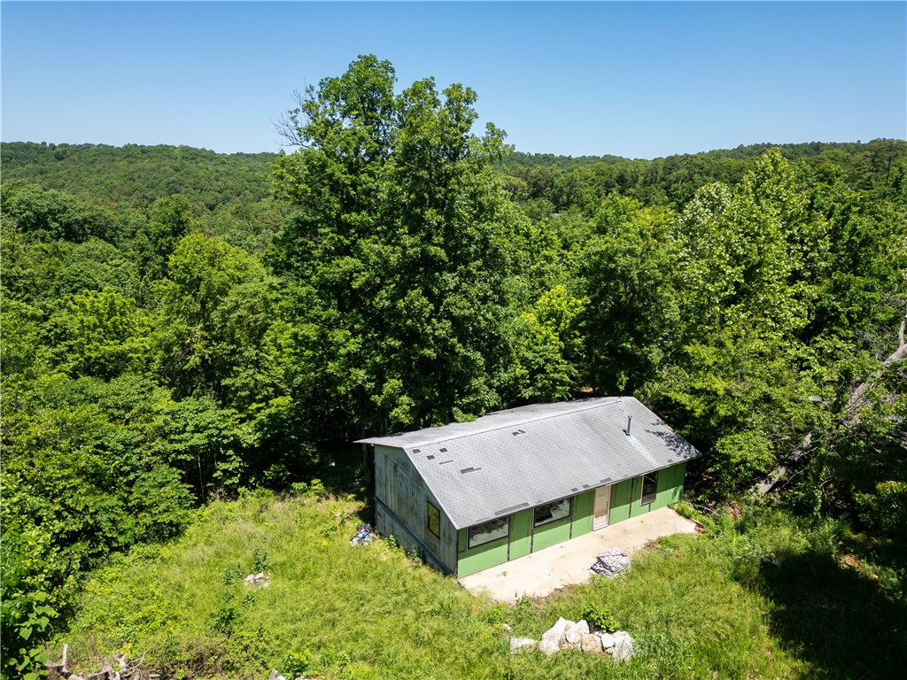 Tucked just minutes from Beaver Lake's Hogscald Hollow and Big Clifty Park, this 1.8-acre unrestricted lot puts you in the middle of everythingāwithout feeling like it. Close to Cureka springs and 30 min. from Rogers. Whether you're dreaming of a cabin, weekend getaway, or something with more room to roam, the location sets you up to make it happen. Electricity is at the street. Well and septic ready. This kind of flexibility in a spot like this doesnāt come along often. This is being bundled with adjacent lot MLS 1302472.