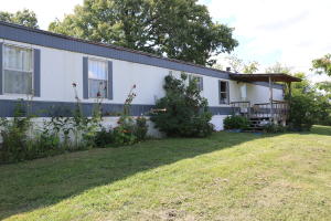 Low cost living with easy access to rivers, lakes, and forest & Ozark Mountains . Six acres for that mini farm so bring your goats an relax!