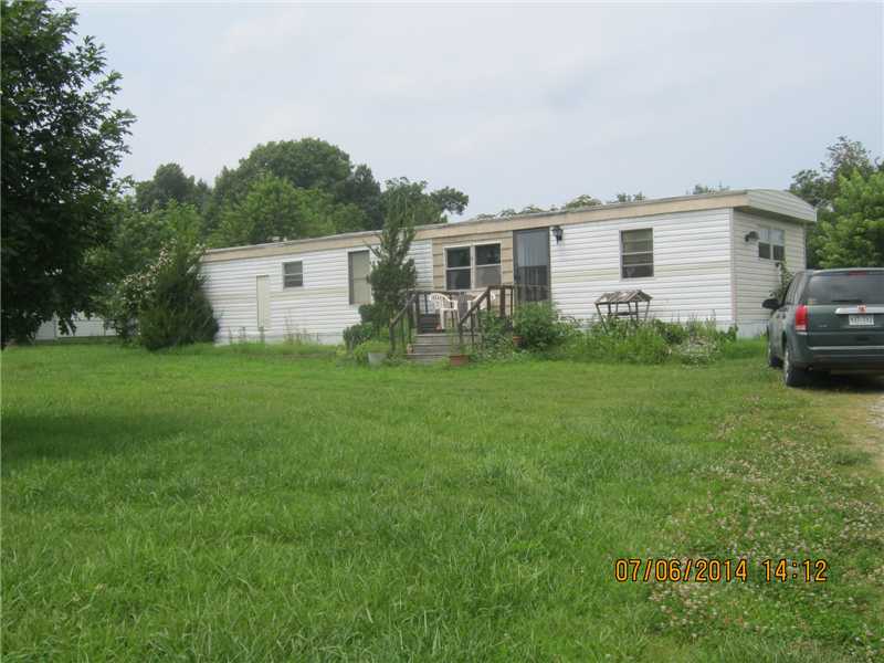 1.75 acres with fixer upper mobile to be sold as is. the land is mostly level cleared in the front but wooded in the back of the acreage. mobile needs work but would make a nice building lot. motivated seller.