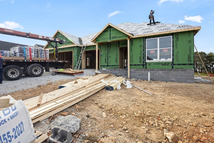 Welcome to Spring Creek Farms, located in the heart of Northwest Arkansas (Cave Springs/Elm Springs). There is something for everyone! A pool, playground & walking trails will be coming in phase 3. Shaw Elementary is just steps away. Enjoy pickleball, tennis, walking trails & more at nearby Shaw Park. This neighborhood has spacious lots with many backing up to green space. Call for more details & options available. The Baxter II Plan is a one-level, 4-bed, 3-bath layout designed with modern living in mind. Features include: 3 car garage, open floor plan, vaulted ceiling with beams, gas log fireplace, soft close custom cabinets to the ceiling, gas range with fully vented hood, built-in microwave and a spacious walk-in pantry in the kitchen. The primary suite features a large walk-in shower for the ultimate spa-like experience. A large back covered patio is complete with internet and gas hookups, ready to entertain. All of this on a great corner lot! A preferred lender credit is available.