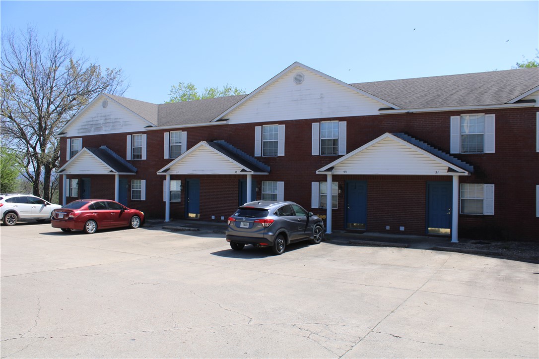 Prime investment opportunity right off the Fayetteville square. 8-unit apartment complex with brick exterior and architectural shingle roof consisting of 2 bed 1.5 bath units, two-levels with deck on each level, apartment building totals 7200 sqft +/-. The duplex is 1643 sqft +/- and each unit is 1 bed 1 bath. All units have a washer and dryer location and are on separate electric and water meters. Downtown general zoning. No showings until accepted contract. Listing agent related to the owner-agent.