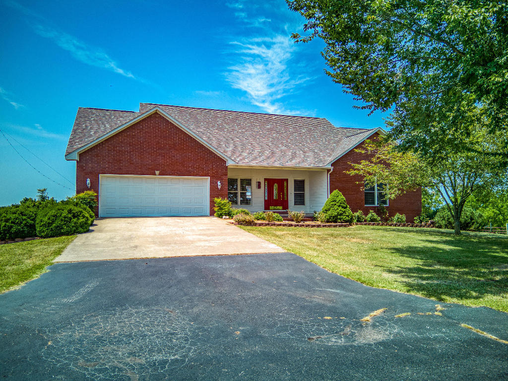Looking for the Home of your Dreams? Check out this Beautiful well built home, Views for miles! Conviently located between Harrison and Branson, this 4 bedroom 2 1/2 Bath 2 story home could be your dream home! Space for everyone! This home beams with pride, showing off with Crown molding, 2 fireplaces, Beautiful wood floors, wood cabinets and solid surface countertops in the Kitchen, the list could go on and on! You'll find abundant storage in every room! Large family/den in basement. 2 Utility rooms, one upstairs and one downstairs. Home has a large covered deck on the back to enjoy your favorite time of the day looking at the view. This home has it all, traditional red barn, storage buildings, 2 car attached garage, Safe room in the basement, and did I mention the view?? Come see!