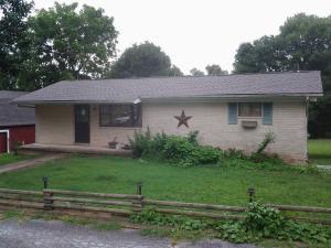 Great business/investment property. Two nicely finished 1 bedroom apartment units (live in one and rent the other). Auto repair shop with vehicle lift and compressor, one car garage in rear. Property also includes two-story barn w/ finished second floor, all on 1.47 acres. Great location and owner ready to sell. Bring all offers!