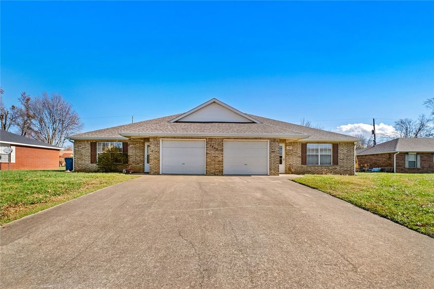 Phenomenal location directly south of the new Wal-Mart Home Office.  Just steps from the Razorback Greenway Trail.  This 2bed/2bath duplex is on a .28 acre lot with two additional/contiguous duplexes also available.  This is a superior location to invest in long term.  Both units have 1 car garages.  Please do not disturb tenants.  Roof is a couple years old.