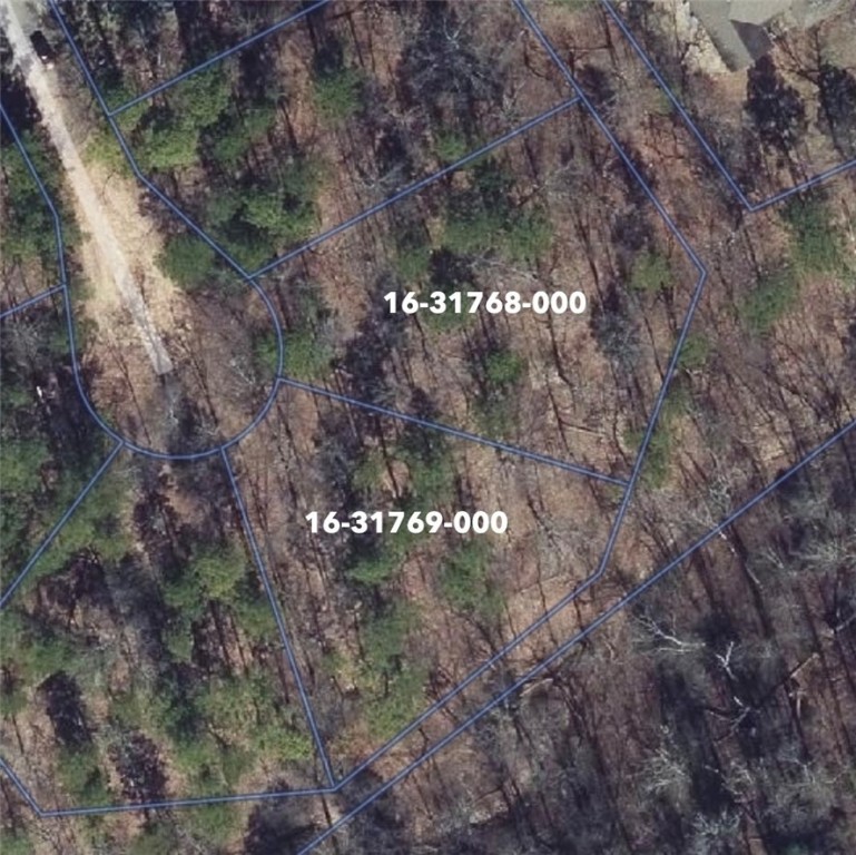 Two prime, buildable lots located in the heart of Bella Vista, perfect for your dream home or future investment. Enjoy direct access to world-class mountain biking with the Back 40 trail just steps away. For those who love fishing or relaxing by the water, Lake Rayburn and Lake Ann are conveniently nearby. A rare opportunity to own land in an established, outdoor-focused community. Build now or hold for future use—don't miss this great opportunity in a fast-growing area! (Perc test completed for a 4-bed.)