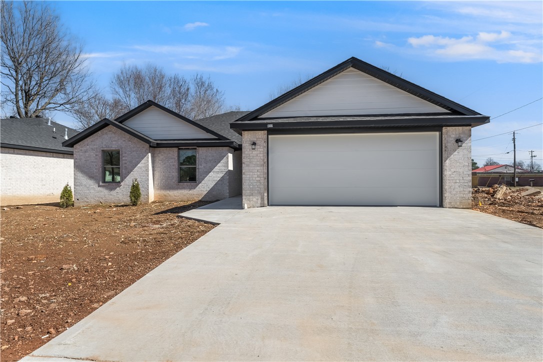 This stunning new construction is located in one of the most thriving areas of Northwest Arkansas. With a modern design, quality craftsmanship, and energy-efficient features, this home is built for comfort and style. It's prime location offers quick access to schools, shopping, dining, and major highways, making everyday living effortless. Spacious living areas and high-end finishes create the perfect space to call home in this growing community. $5,000 TOWARD BUYER'S CLOSING COST, and 1 Year Builder's Warranty.