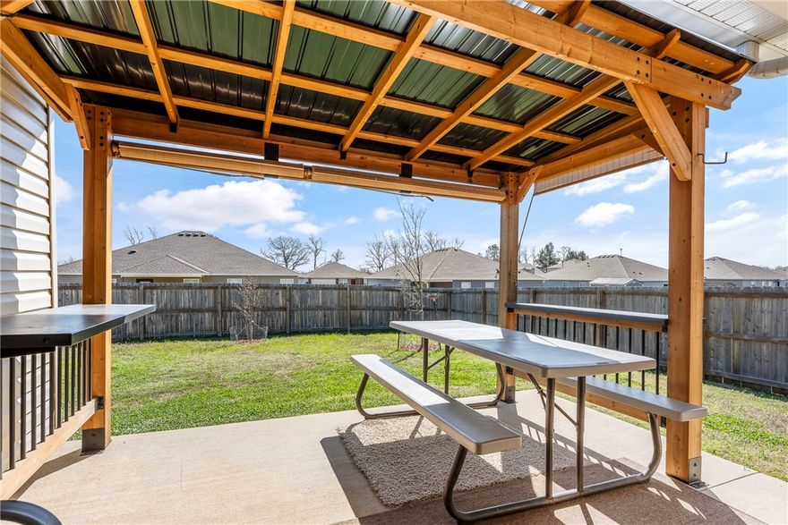 Welcome to easy living in this like-new, barely lived-in home. Built just 2 years ago, it offers the benefits of new construction without the wait. Inside features an open layout with granite countertops, modern finishes, and a functional floor plan. The oversized corner lot includes a fully fenced backyard, newly planted trees, and a cedar pergola over the patio for shaded outdoor living. Located in a newer subdivision near Pea Ridge schools, this home offers both convenience and a quiet neighborhood feel. Ideal as a starter home, investment property, or downsize opportunity.