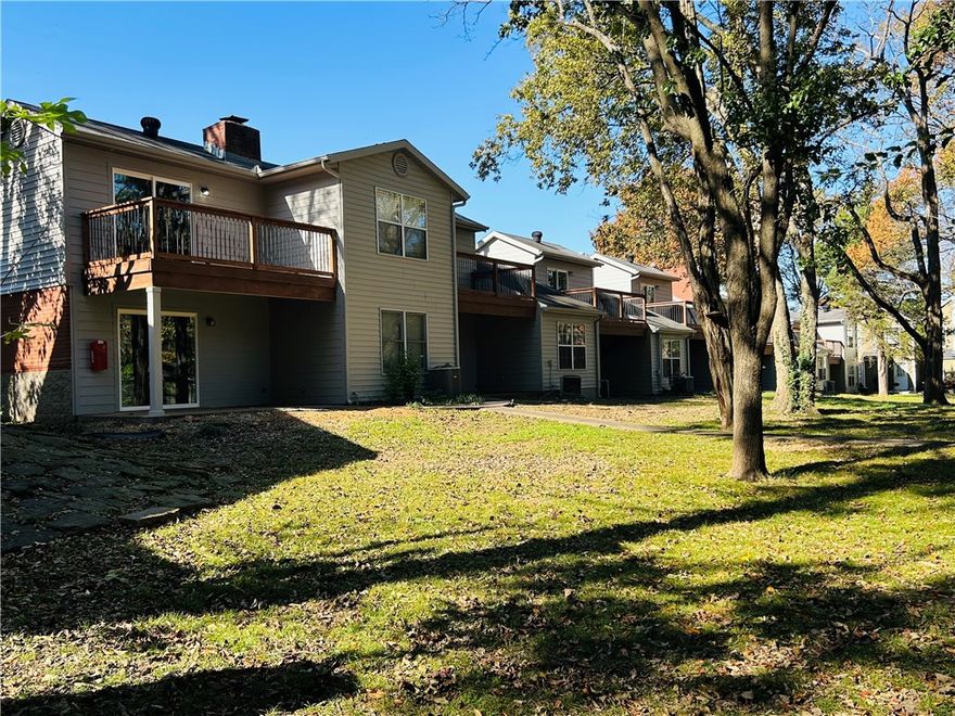 Lovely East Fayetteville condo within walking distance to Gulley Park, trails, restaurants and just a few miles from Lake Fayetteville, the University of Arkansas and the Entertainment District.  Inside, you will find a fully remodeled home, complete with fresh paint, new flooring, updated lighting and fresh fixtures throughout.  The kitchen has been modernized with quartz countertops, subway tile backsplash, and new stainless steel appliances. The first floor also features an outdoor covered patio, a large living and dining area, and a downstairs master suite for convenience.  Upstairs you will find a second bath and another bedroom or office with balcony views of the neighborhood park, trails, tennis courts and pool.  The tennis courts and pool are soon to undergo a full renovation.   Enjoy carefree living while the POA takes care of exterior maintenance, landscaping, insurance, and more - leaving you to enjoy all of the beauty and amenities Fayetteville has to offer.