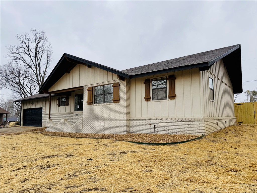 Completely Renovated. Just minutes from Downtown Bentonville and bike trails. Wood style flooring throughout. Living room has vaulted ceiling and wood burning fire place with original native stonework. Kitchen features stainless appliances, new cabinets and granite. Master bedroom includes double sinks, large tile shower and large walk in closet. Awesome covered deck that leads to huge fully fenced back yard.