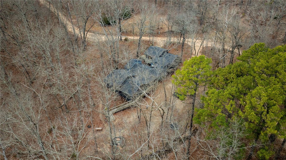 Nestled just 7 minutes from downtown Eureka Springs, this incredible investment property consists of two separate properties. Promise Mountain 1 sits on 12.55 acres and features 3 fully functional Airbnb units, a 3-bedroom property management unit, as well as 3 long-term units (fully leased). The property has undergone perk testing at multiple sites, providing the potential for future expansion and additional units. Promise Mountain 2 offers 5 additional remodeled airbnb units, all gutted and beautifully redesigned with unique city-themed interiors, making this a truly one-of-a-kind property. This completely turn-key business includes an onsite property manager who handles all bookings, cleaning, and guest services. The property manager may remain in place if desired, offering seamless transition and continued success. The business is ready for immediate operation, with ample potential for growth. Don't miss out on this rare opportunity.