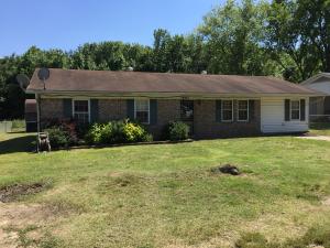 Just a little TLC and this would be a great starter home. It's on a corner lot and has an added bedroom that is not included in to total square footage.