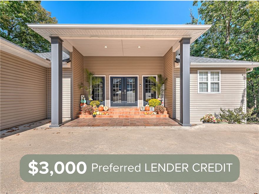 Welcome to this inviting Bella Vista home offering fresh updates, flexible living spaces, and a peaceful wooded setting. Located on a quiet street near Lake Ann, Lake Brittany, Pinyon Creek, and the Flo Ride trails, this home delivers both comfort and lifestyle. The main level features a bright living area with vaulted ceilings, luxury vinyl flooring, three comfortable bedrooms, and two and a half updated baths.

The finished lower level adds incredible versatility with a large game room, second living area, custom bar, and a spacious bedroom with an ensuite bath, ideal for a second primary suite, guest space, or private in-law retreat. Enjoy two expansive levels of decking with wooded views, perfect for relaxing or entertaining. Additional highlights include fresh interior paint, smart thermostats, a roof installed in 2021, and updated HVAC units upstairs in 2021 and downstairs in 2024.

Now offering a $3,000 Preferred Lender Credit. A warm, welcoming home ready for its next chapter.