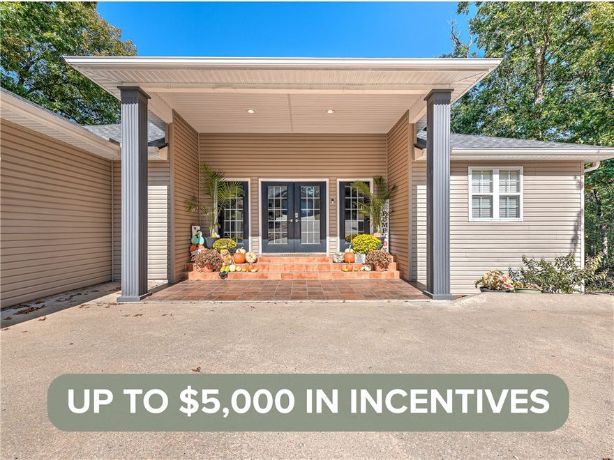 Now offering a $3,000 Preferred Lender Credit and a $2,000 Seller Credit. Welcome to this inviting Bella Vista home offering fresh updates, flexible living spaces, and a peaceful wooded setting. Located on a quiet street near Lake Ann, Lake Brittany, Pinyon Creek, and Flo Ride trails, this home delivers both comfort and lifestyle. The main level features a bright living area with vaulted ceilings, luxury vinyl flooring, three comfortable bedrooms, and two and a half updated baths.

The finished lower level adds incredible versatility with a large game room, second living area, custom bar, and a spacious bedroom with an ensuite bath, ideal for a second primary suite, guest space, or private in-law retreat. Enjoy two expansive levels of decking with wooded views, perfect for relaxing or entertaining. Additional highlights include fresh interior paint, smart thermostats, a roof installed in 2021, and updated HVAC units upstairs in 2021 and downstairs in 2024. A warm, welcoming home ready for its next chapter.